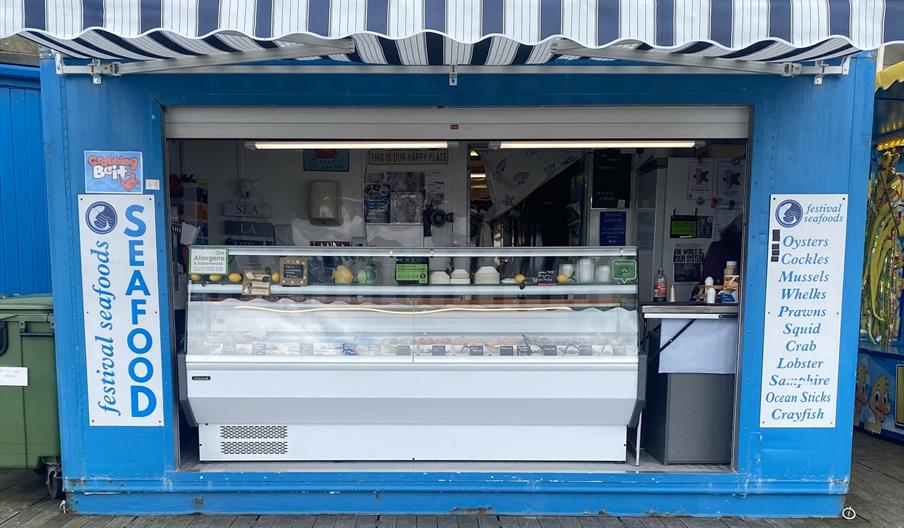 Blue and white stall selling a wide range of seafood and fish