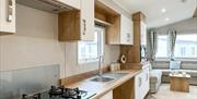 Kitchen view wheelchair accessible caravan Abergele