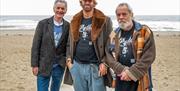 Terry’s fellow Monty Python’s Michael Palin and Terry Gilliam, on Colwyn Bay Promenade at the site of the statue, with its creator Nick Elphick