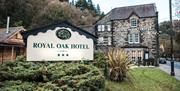 Image of front entrance and sign for Royal Oak Hotel