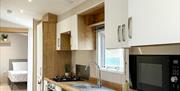 Another view of kitchen in wheelchair accessible caravan Abergele